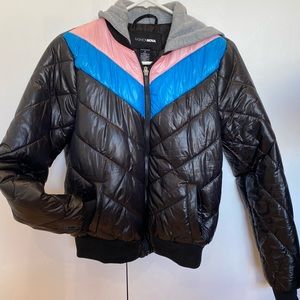 Black puffer jacket with pink and blue details and grey hoodie